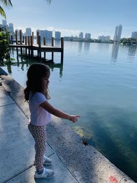 Little girl looking up on the bay