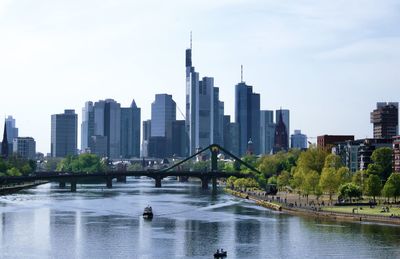 View of buildings in city at waterfront in frankfurt am main