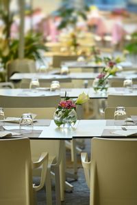 Empty chairs and tables in restaurant terrace