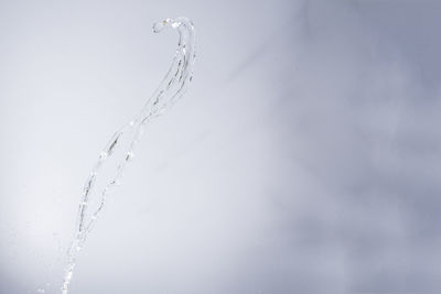 Close-up of water splashing against white background