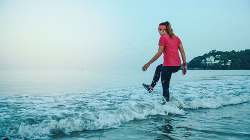 Full length of man on sea against sky