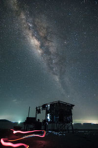 Light painting against sky at night