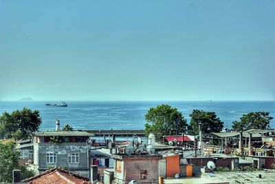 View of sea with buildings in background