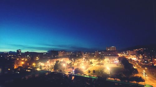 High angle view of illuminated cityscape at night