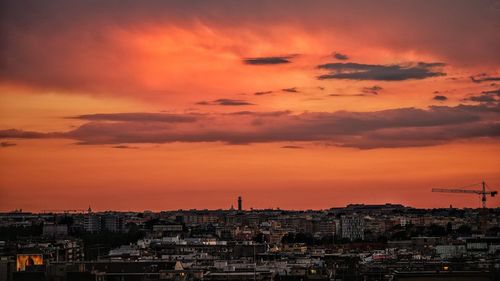 High angle view of city against sky during sunset