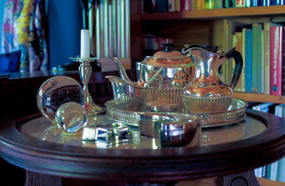 Close-up of glasses on table at home