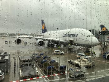 City seen through wet window during rainy season