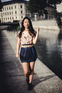 Portrait of a beautiful young woman in city