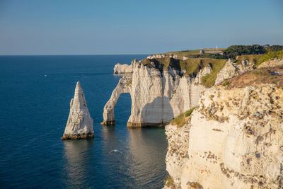 Scenic view of sea against evening sky to alabaster coast, Étretat, normandie, france.