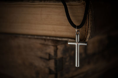 Close-up of cross and bible