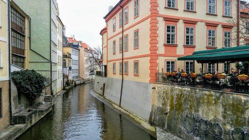 Canal amidst buildings in city