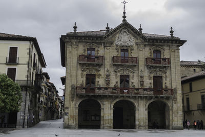 View of old building against cloudy sky