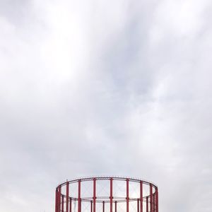 Low angle view of rollercoaster against sky