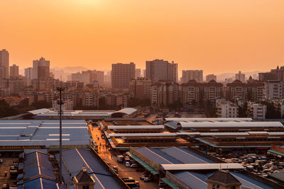 High angle view of cityscape against sky during sunset