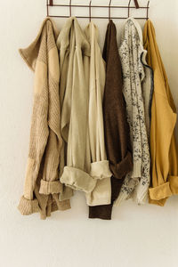 Close-up of clothes hanging against wall