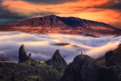 Panoramic view of snowcapped mountains against sky during sunset