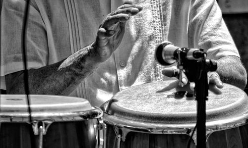 Close-up of man playing piano