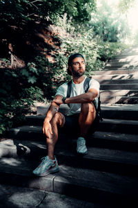 Portrait of young man sitting outdoors