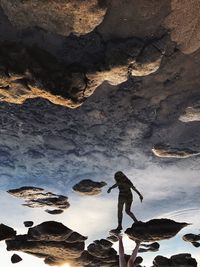 Man standing on rock formation