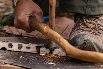 Close-up of man working on wood