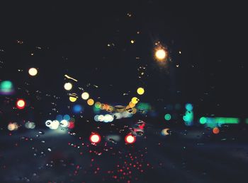 View of illuminated road at night