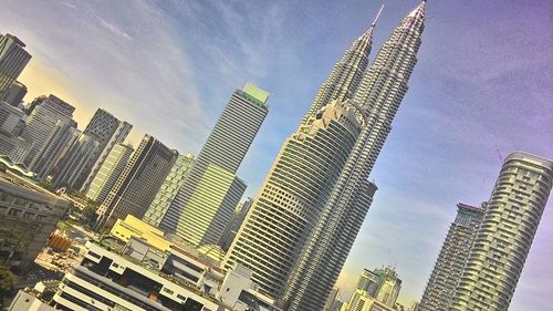 Low angle view of modern buildings against sky