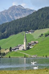 Scenic view of lake and mountains against sky