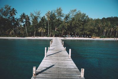 Pier over sea against sky