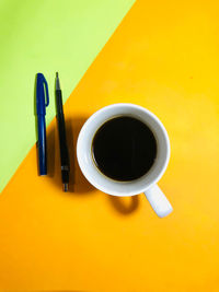 Directly above shot of coffee cup on table