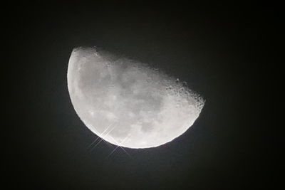 Low angle view of moon against sky at night