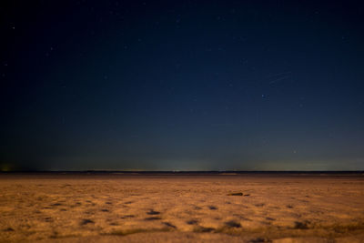 Scenic view of landscape against sky at night