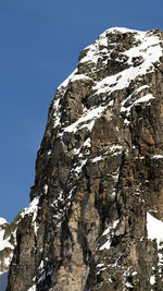 Low angle view of rock formations against sky