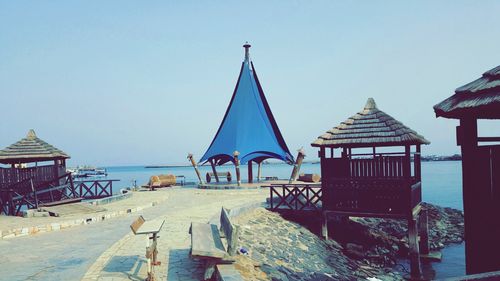 Panoramic view of beach against clear sky