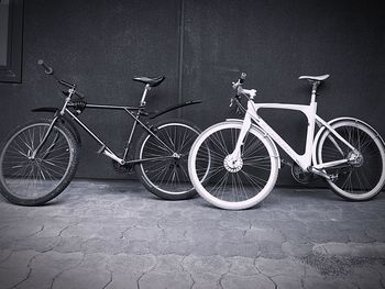 Bicycle parked against wall