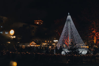 Illuminated christmas tree at night