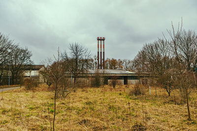 Built structure on field against sky