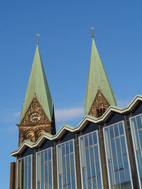 Low angle view of traditional building against blue sky