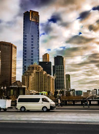 City street against cloudy sky