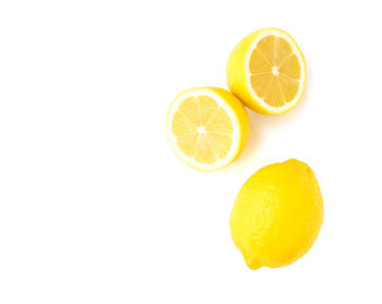 Close-up of lemon against white background