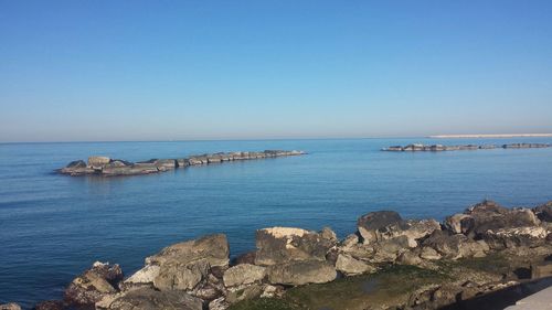 Scenic view of sea against blue sky