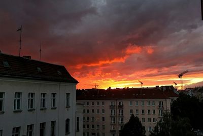 High section of building against dramatic sky