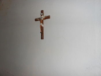 Close-up of cross on wall