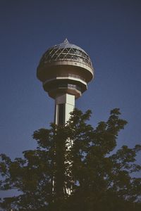 Low angle view of water tower against clear sky