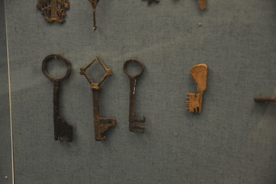 Close-up of rusty metal hanging on wall