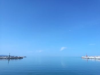 Scenic view of sea against blue sky