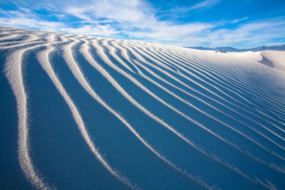 Scenic view of landscape against blue sky