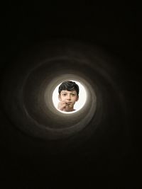 Boy at the end of a tunnel