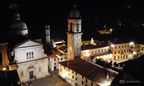 High angle view of illuminated buildings in city at night