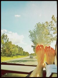 Cropped image of car on road