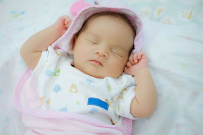 Cute baby sleeping on bed